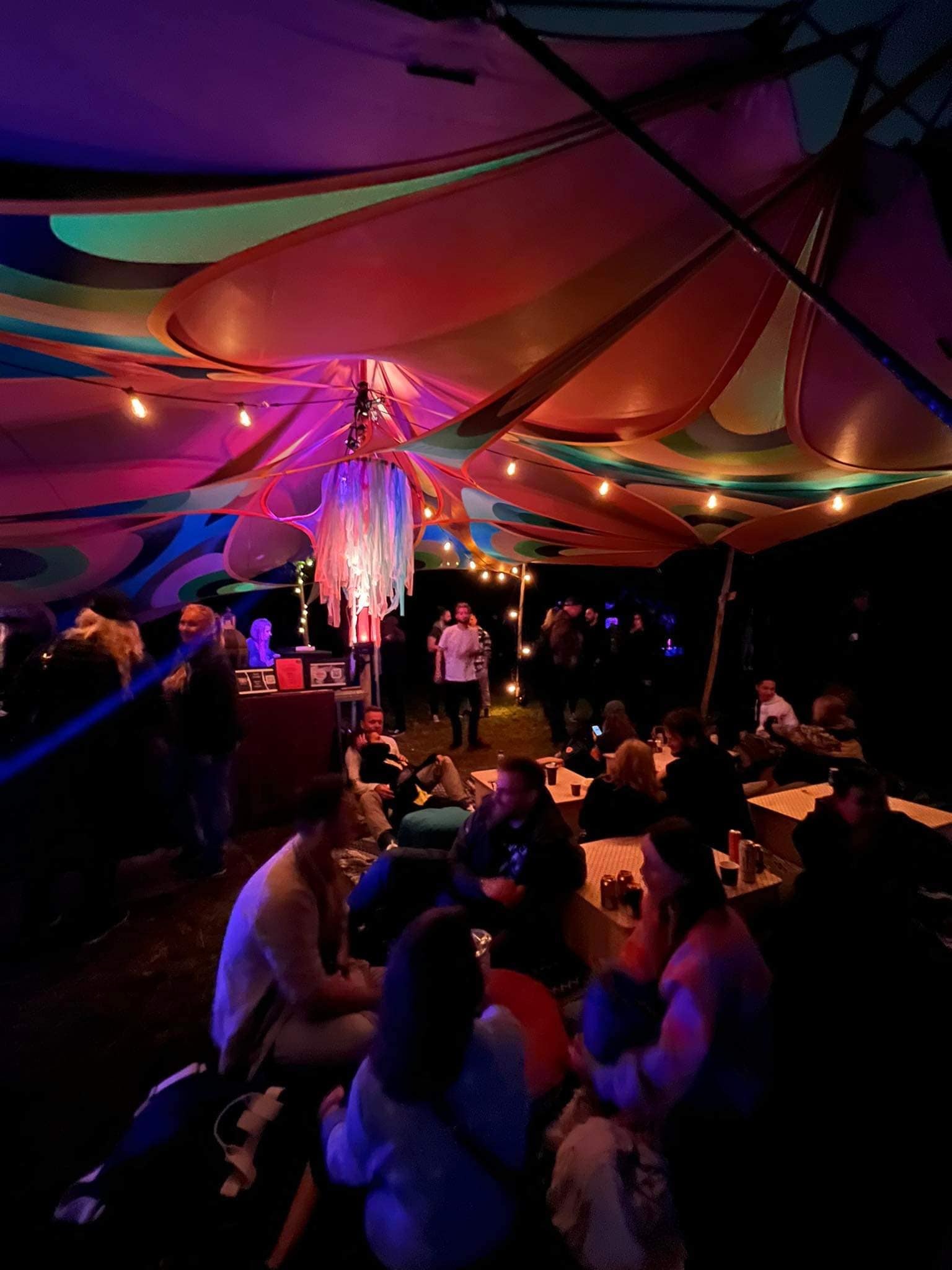 Dancers under coloured lights at the Cirkus Paralello Chill Out / Café